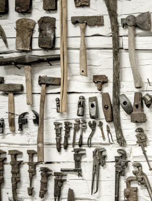 Collection of tools hanging on a wall